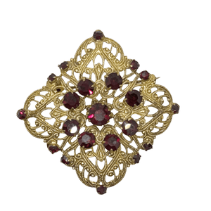 Intricate Vintage Gold Tone Brooch with Ruby Red Stones